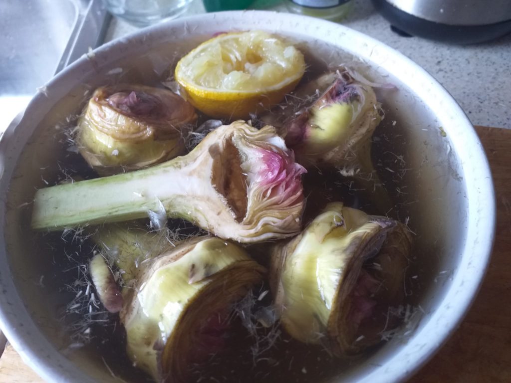 roman style artichokes - marinating in lemon water